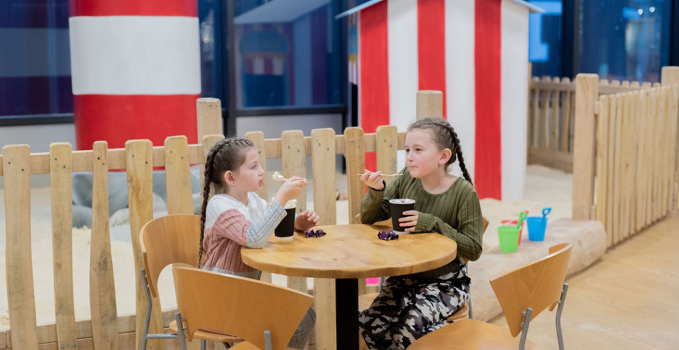 Children enjoying snacks at the Wild Things Play Project